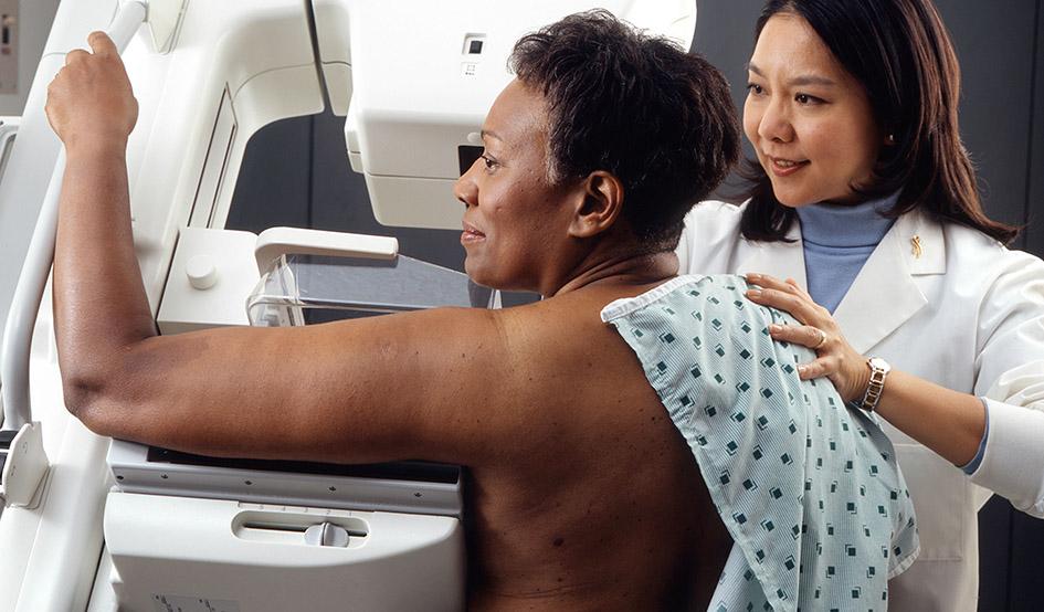 Larger woman receives mammogram