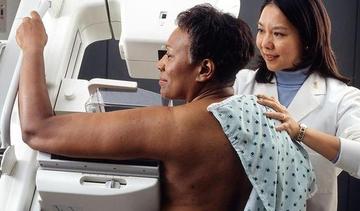 Small woman receives mammogram